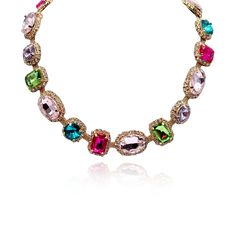 Introducing our stunning Multi-Color Stone Necklace, a versatile and vibrant accessory that effortlessly transitions from casual daywear to elegant evening attire. This necklace features a dazzling array of stones including Light Rose, Light Amethyst, Fuchsia, and various other colors, surrounded by delicate pave settings, all set on a soft gold chain for comfort and ease of wear. The combination of vibrant colors adds a playful and eye-catching dimension to any outfit, making it the perfect accessory to brighten up your wardrobe. Whether you're pairing it with a casual ensemble for a day out or dressing it up for a dinner date, this necklace is sure to make a statement and showcase your unique sense of style. Avoid contact with water and cosmetics, such as creams or perfumes. Clean with a Multicolor Necklaces With Gemstone Accents For Formal Occasions, Formal Multicolor Jeweled Necklaces, Formal Multicolor Jeweled Necklace, Elegant Multicolor Necklace With Gemstone Accents, Elegant Multicolor Jeweled Necklaces, Elegant Multicolor Stone Necklaces, Elegant Multicolor Gemstone Crystal Necklace, Multicolor Gemstone Crystal Necklace, Elegant Multicolor Rhinestone Necklace For Gift