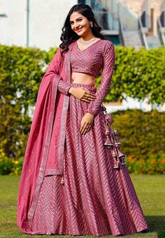 Readymade Faux Georgette Lehenga in Pink. This attire with Shantoon and Cotton Lining is Enhanced with Fancy Tassels, Side Zip, Resham and Mirror WorkAvailable with a Faux Georgette Pink Choli Crafted in V Neck and Full Sleeves and a Faux Georgette Dupatta in Pink. The Choli and Lehenga Lengths are 14 and 42 inches respectively. Do Note: Accessories shown in the image are for presentation purposes only. (Slight variation in actual color vs. image is possible). We sell all kinds of Lehenga and Ch Women's Lehanga Design, Georgette Lehenga Choli Designs, Colorful Sangeet Outfit, Women Lehanga Designs, Short Sleeve Lehenga, Hand Embroidered Lehenga, Lehenga Designs With Sleeves, V Neck Choli Designs, Full Length Blouse Designs For Lehenga