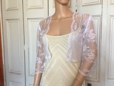 This is a beautiful hand made white lace jacket ideal for weddings or special occasions. The jacket has 3/4 length sleeves. It can also be worn with casual wear. It can be made in any size from 8 to 24 (UK sizes). It is made in the UK. It is normally sent out to you within 5 days, but I am very happy to make your order a priority if you need it urgently. Just let me know the date needed by. Postage is free in the UK! International postage is £9. I am happy to exchange items or refund your paymen White Lace Jacket, Shrug Jacket, Bolero Shrug, Lace Jacket, Beautiful Hand, Three Quarter, White Lace, Bridal Gowns, The Uk