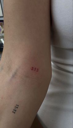 a woman with a small tattoo on her arm