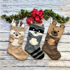 three christmas stockings with animals on them