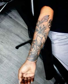 a person with a flower tattoo on their arm