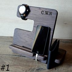 a cell phone is sitting on a wooden stand