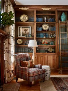 a living room filled with furniture and bookshelves