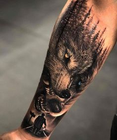 a man with a wolf tattoo on his arm