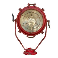 an old fashioned red light on a white background