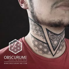 a man with a neck tattoo that has geometric designs on it