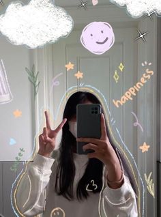 a woman taking a selfie in front of a mirror with the words happiness written on it