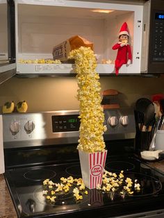 the elf is in the microwave with popcorn