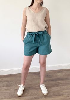 Handmade washed linen loose shorts with pockets and elastic waist. Made with love for You. *100% local medium weight linen *Washed linen *Elastic waist *Each item is individually cut and sewn by order *The model is wearing size M, shorts color - Viridian blue *Note that colors may look different on your display depending on their settings and technical characteristics. Please let us know if you need different measurements or colors. CARE: *Machine wash up to 40 / 104F gentle cycle *Iron inside o Summer Linen Bottoms With Paperbag Waist, Casual Linen Shorts With Tie Waist, Green Linen Shorts With Pockets, Spring Green Linen Shorts, Green Linen Summer Bottoms, Green Linen Beach Shorts, Green Linen Summer Shorts, Wrap Dresses Summer, Simple Midi Dress