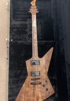 an electric guitar in its case on display