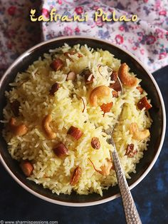 a bowl filled with rice and nuts on top of a table