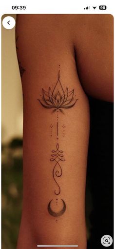 a woman's arm with a lotus tattoo on the left side of her body