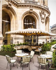 an outdoor dining area with tables and chairs