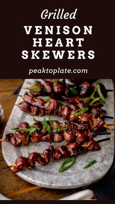 grilled venison heart skewers on a platter with text overlay