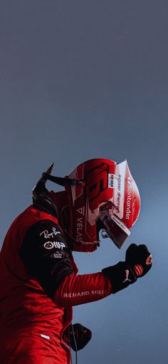 a snowboarder in the air with his helmet and goggles attached to his face