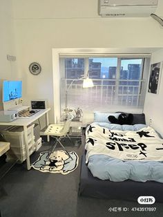 a bed room with a neatly made bed next to a computer desk and a window