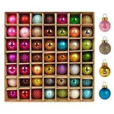 a box filled with lots of different colored ornaments