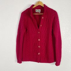 Aran Crafts Fisherman Cardigan Sweater Size Medium Red Cable Knit Long Sleeves Button Closure Pockets Made In Ireland Dry Clean 100% Merino Wool Bust 20” Across, Shoulder To Bottom Hem 25.5” Pre Owned, Good Condition. No Holes Or Stains. |All Measurements Are Approximate| [Hang] Fall Winter Warm Cozy Knit Classic Red Cardigan With Buttons, Classic Red Buttoned Cardigan, Fisherman Cardigan, Cozy Knit, Cozy Knits, Colorful Sweaters, Warm Winter, Cardigan Sweater, Warm And Cozy