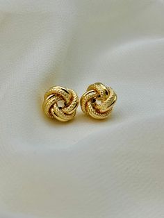 18k Gold love knot Stud Earring , 11 MM , 2.14 gr 18k Gold love knot Stud Earring , 7 MM , 1  gr Priced to sell! Compare our prices to other similar sellers! Arrives in a GIFT BOX and includes FREE SHIPPING within the USA and Canada. International shipping is available at the most economical rates on ETSY. I HAVE BEEN IN THE JEWELRY BUSINESS ALL MY LIFE. I am a second -generation family member making gold and jewelry. Please feel free to ask me any questions - Always happy to help! Fast Replies Gold Earrings For Mother's Day Formal Occasion, Gold Plated Earrings For Anniversary, Gold-plated Earrings Stamped 14k For Anniversary, Gold 14k Earrings For Mother's Day, Mother's Day 14k Gold Earrings, 14k Yellow Gold Earrings For Mother's Day, 14k Gold Earrings For Anniversary And Mother's Day, Yellow Gold 14k Earrings For Mother's Day, Fine Jewelry Yellow Gold Earrings For Mother's Day