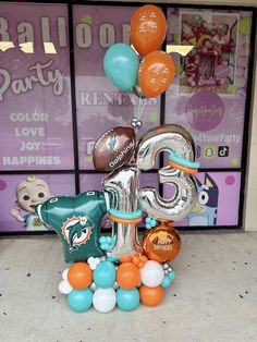 balloons are arranged in the shape of an elephant and number twenty five, along with other decorations