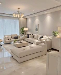 a living room filled with lots of white furniture