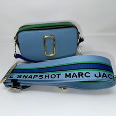 --Marc Jacobs Snapshot Purse --Misty Blue Multi Colorway --New With Tags --Saffiano Leather --Dual Top Zip Closure --Removable And Adjustable Webbing Strap --Interior Slip Pocket, Exterior Slip Pocket --Faille Lining --7in L X 2in D X 4in H; Strap 8-57in L X 2in D; Strap Drop 27in Camera Bag Purse, Marc Jacobs Crossbody Bag, Red Crossbody Bag, Mini Messenger Bag, Cream Bags, Hobo Crossbody Bag, Black Leather Crossbody Bag, Marc Jacobs Bag, Black Cross Body Bag