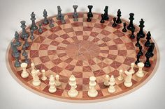 a chess board with pieces arranged in the shape of a circle on top of it