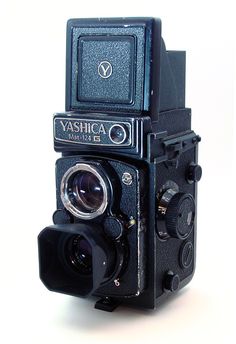 an old fashioned camera on a white background