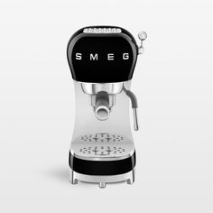 an espresso machine with the word smeg on it