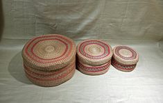 three woven baskets sitting next to each other