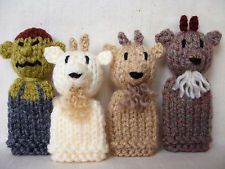 four knitted animals are lined up in a row