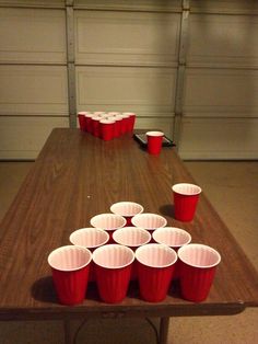 a table with red cups on top of it