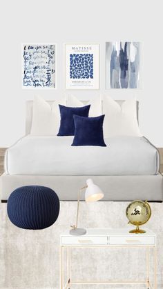 a bedroom with blue and white decor on the walls, furniture and artwork above it