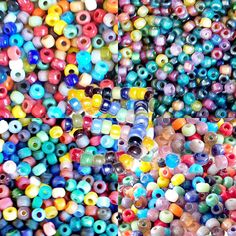 many different colored beads are stacked together in a pile on the floor and one has a black hole at the top