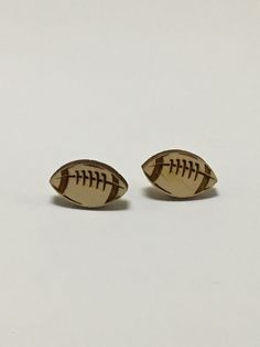 Cute laser cut Football earrings with stainless steel post and backing. Laser cut from Birch wood. Wooden Football, Bling Bra, Football Jewelry, Football Spirit, Buffalo Football, Patriotic Jewelry, Football Earrings, Football Accessories, Glass Drop Earrings