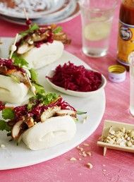 some food is sitting on a plate and ready to be eaten with other foods in the background