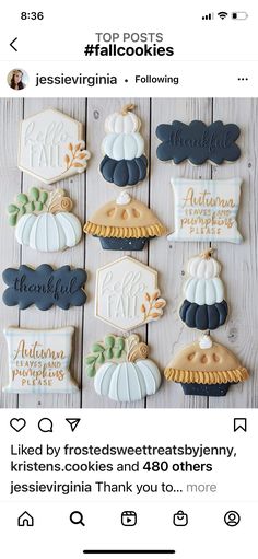 some cookies that are sitting on top of a wooden table with the words, thanksgiving and pumpkins