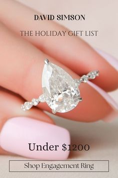 a woman's hand holding an engagement ring with the words under $ 200