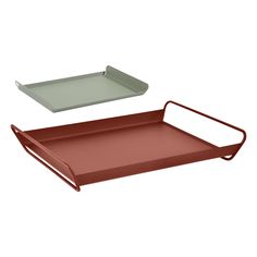 two red trays with handles and one green tray on the top, both in different colors