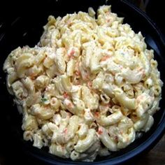 a black bowl filled with macaroni and cheese