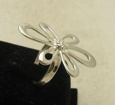 Sterling silver flower ring 925/1000. Stamped 925. Approximate weight 4.7 grams. Front dimensions 3.7x2.3 cm (1.48x0.92 inches). All our jewels are made from solid sterling silver 925/1000 and are carefully crafted by hand in our family workshop. We dispatch your orders in 5 working days, worldwide and the postage is $5. We ship registered priority mail. Please allow 5-7 working days for delivery in Europe and 10-15 working days outside Europe. For any questions - please do not hesitate to conta Formal Flower Ring Stamped 925, Sterling Silver Flower Ring For Formal Occasions, Formal Sterling Silver Flower Ring, Silver Flower-shaped Ring For Formal Occasions, Formal Flower Shaped 925 Silver Ring, Hallmarked Sterling Silver Flower Ring, Hallmarked Silver Flower Ring, Unique Silver Flower Shaped Ring, Silver Flower Ring