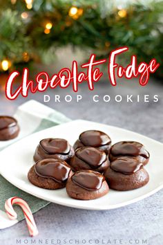 chocolate fudge drop cookies on a white plate with candy canes in the background