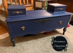 a blue dresser sitting on top of a carpeted floor