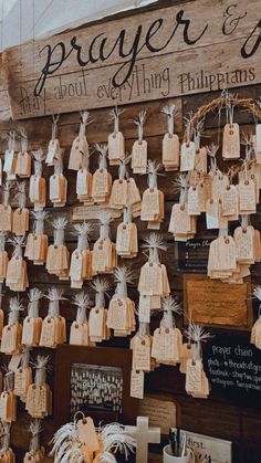 the wall is decorated with paper bags and tags