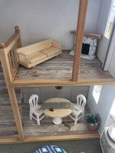 the inside of a doll house with furniture