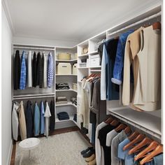 a walk in closet filled with lots of clothes