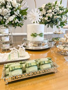 a table topped with lots of cakes and desserts