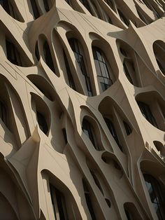 the facade of a building that looks like it's made out of wavy shapes