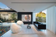 Light filled modern chic Los Angeles home with custom art, design details & AIA architecture. Large Art Projects, Modern Black Couch, Fur Chairs, Los Angeles Loft, Loft Style Homes, Black Couch, Open House Plans